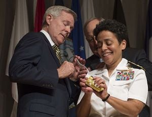 Michelle Howard is the first woman to be promoted to the rank of admiral in the history of the U.S. Navy. Secretary of the Navy Ray Mabus assists in placing four-star shoulder boards on her service white uniform. (Photo: Peter D. Lawlor/U.S. Navy)