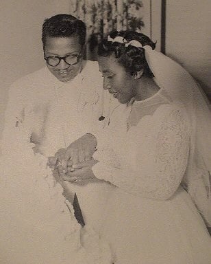 Alice Marie Herndon cuts wedding cake with her childhood sweetheart, Joseph Shurn, in 1955.