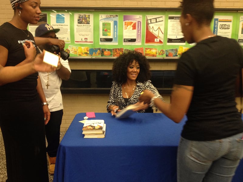 Miko Branch signs books at the Martin Luther King Jr. Memorial Library in Washington, D.C. (Photo: Megan Sims/FierceforBlackWomen.com)