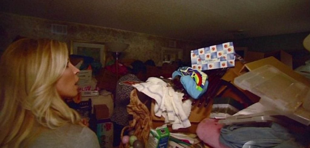 Trainer Heidi Powell visits Mitzi White's home, which was stacked, ceiling to floor, with her shopping finds and mementoes of her mom. (ABC Photo)