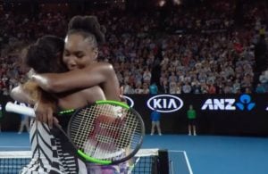Venus and Serena Williams hug after the singles championship at the Australian Open. (Screen shot from Tennis Australia video)